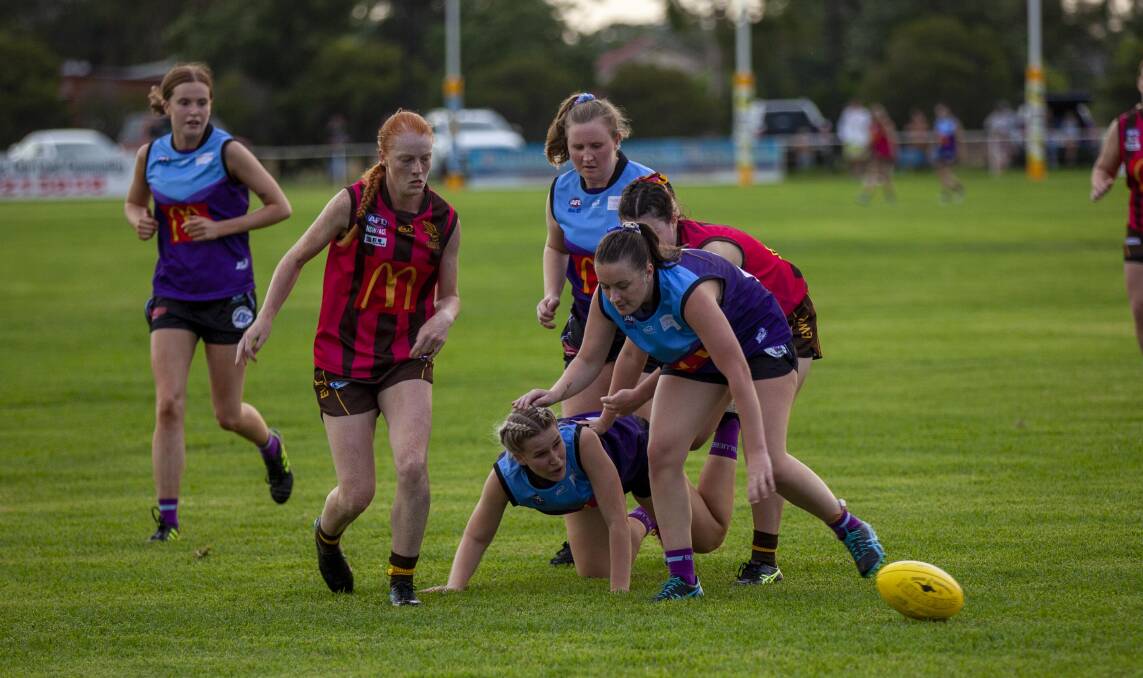 PRESSURE: East Wagga-Kooringal and Brookdale Bluebells compete in their first match on Friday night. Picture: Contributed