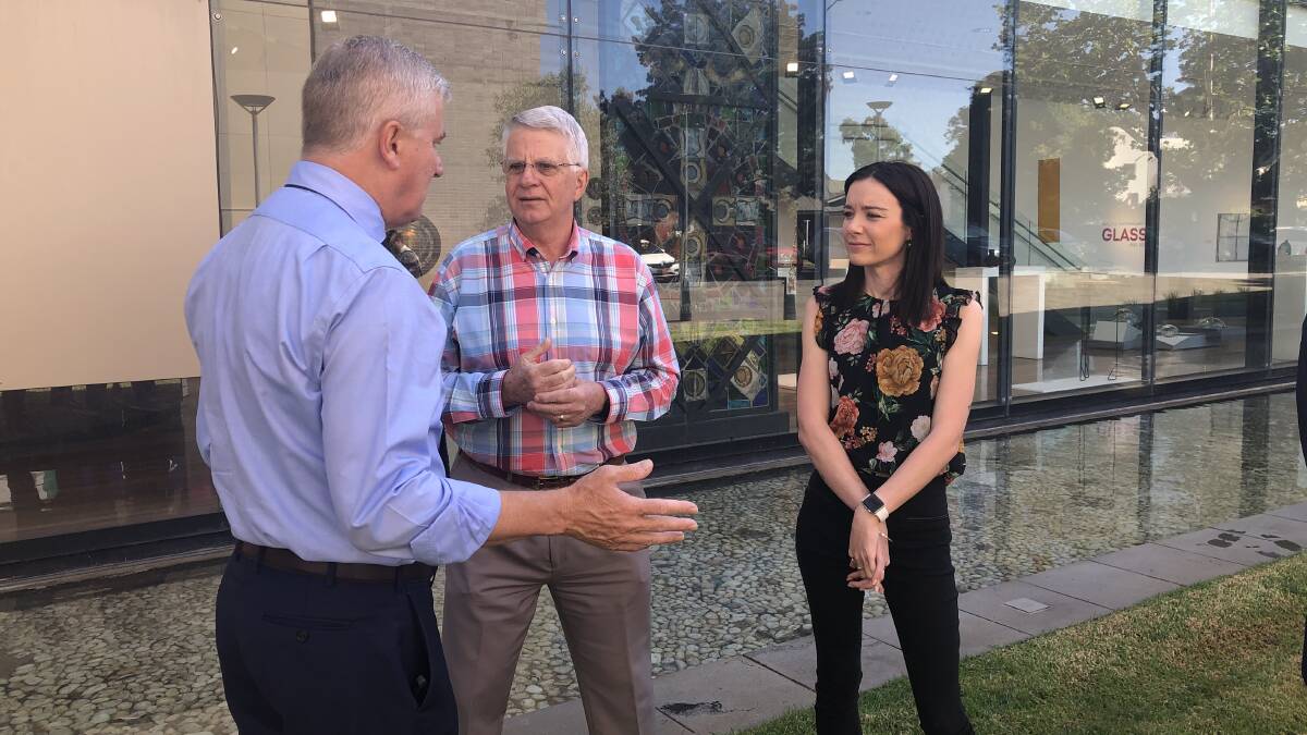 IN TALKS: Deputy PM Michael McCormack speaks with business leaders Alan Johnston and Casey Wilson. Picture: Rachel McDonald