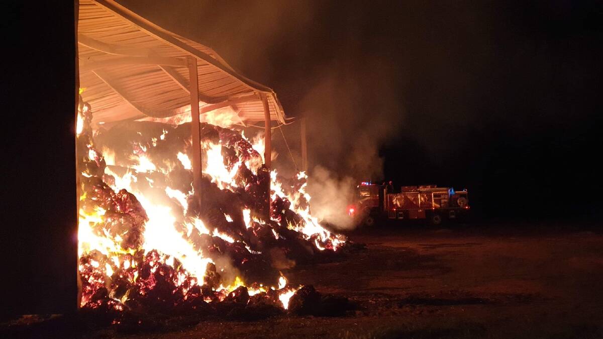 FIRE: RFS crews attend a hay fire at Brookdale which destroyed the shed and about 360 bales. Picture: Riverina RFS
