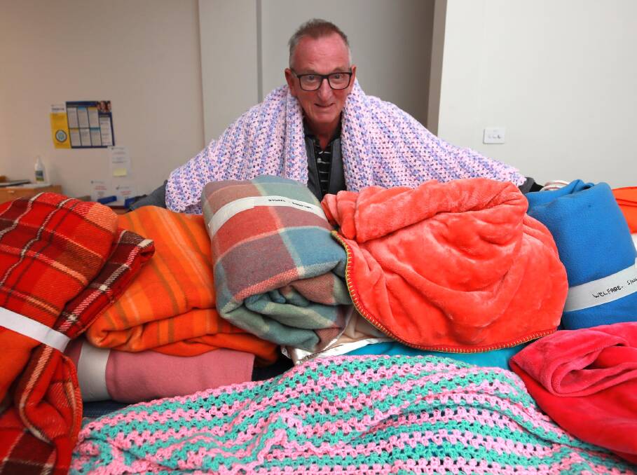 GENEROSITY: Vinnies council president Peter Burgess with recent donations of blankets to keep people warm this winter. Picture: Les Smith