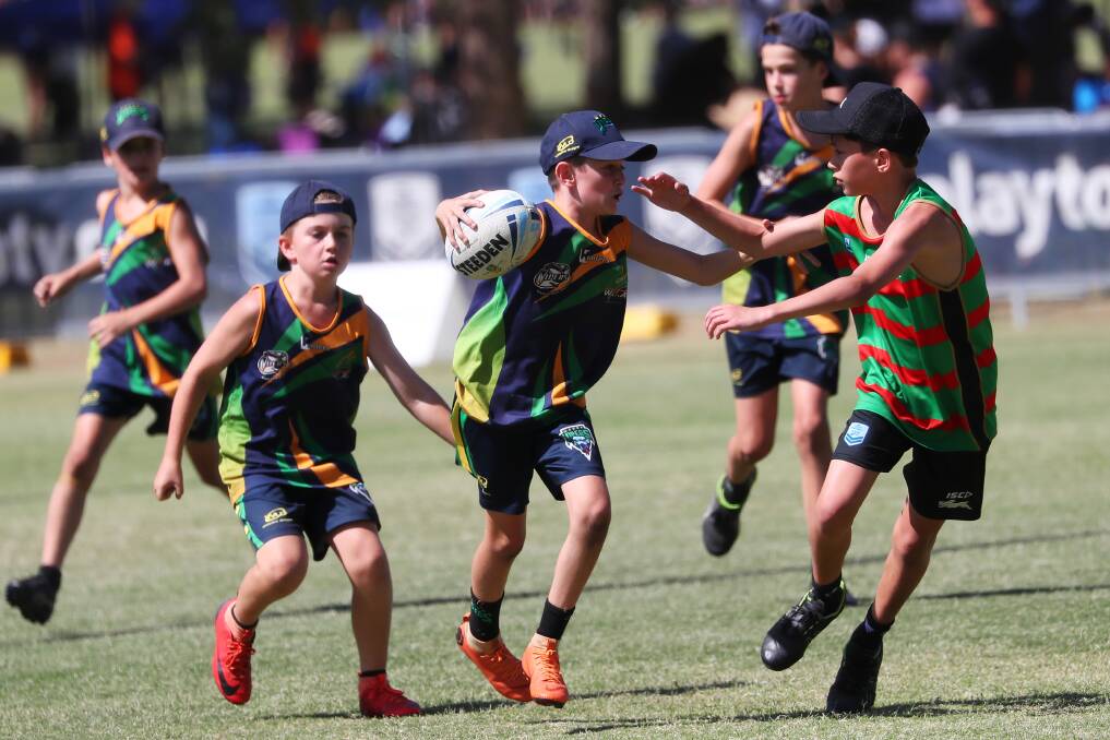 DRAWCARD: Jace Lucas with the ball in the 12 years boys UNSW Souths v Wagga Vipers game last year at the Touch NSW Junior State Cup.