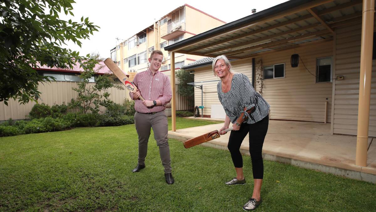 PIECE OF HISTORY: PRD Wagga's Harry Mangelsdorf and Amanda Tilyard in the famous backyard. Picture: Les Smith