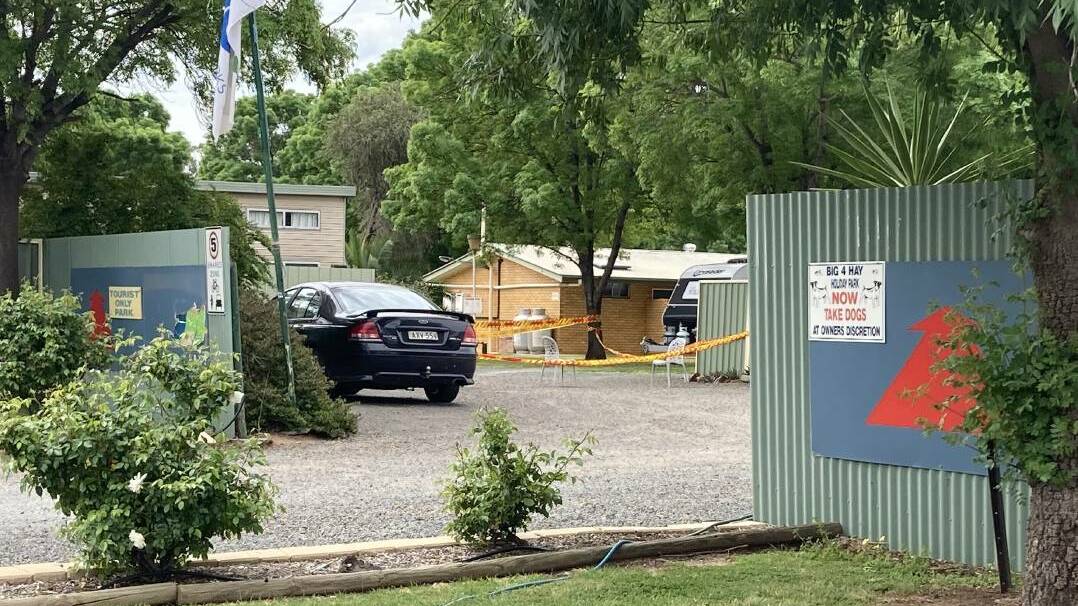 Police at the Big4 caravan park in Hay on Tuesday after two workers were hospitalised on Monday due to encountering an unknown powder in one of the cabins.