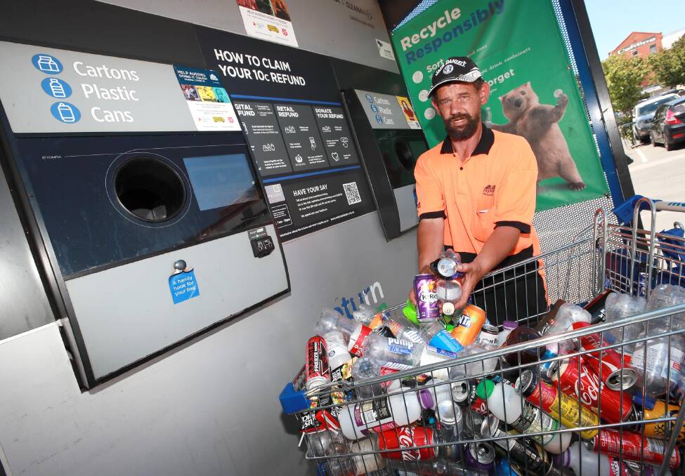 DEPOSIT: Jason Aveyard contributes to the 30 million cans and 16.5 million glass bottles recycled in three years under Return and Earn in Wagga. Picture: Les Smith