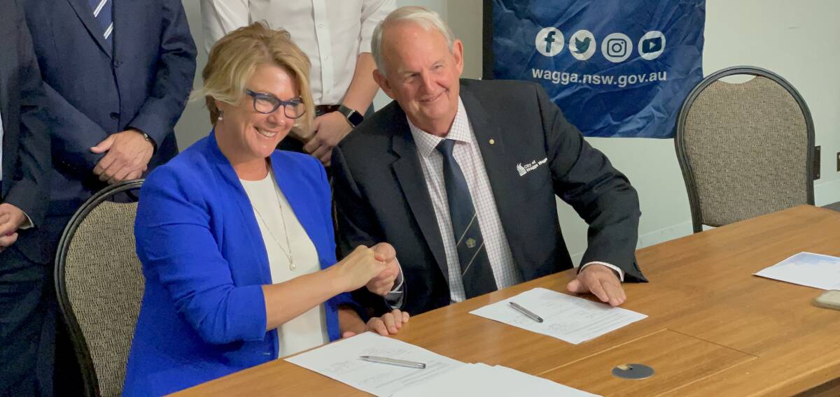 DEAL: NSW Water Minister Melinda Pavey (left) and Wagga mayor Greg Conkey on Wednesday sign an MOU to replenish Lake Albert. Picture: Rex Martinich