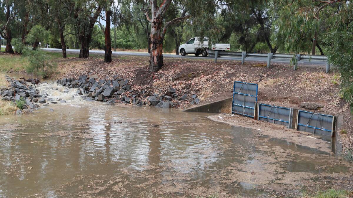 Water back up behind 'unlawful' shutters across Tatton Drain near Lake Albert following a storm on Wednesday. The person who installed the potentially illegal water diversion has contacted Wagga City Council and the shutters were removed as of Thursday. Picture: Les Smith 