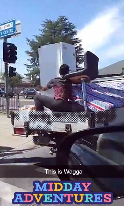 Police are investigating this image that appears to show a young man riding in the back of a utility vehcile in Wagga with an unsecured load. Picture: NSW Police Force Traffic and Highway Patrol Command