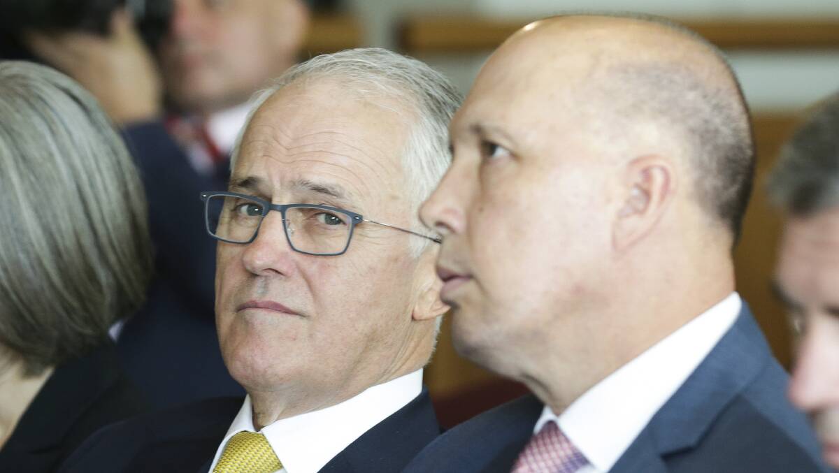 Prime Minister Malcolm Turnbull and Minister for Home Affairs Peter Dutton during a Refugee Week event at Parliament House in Canberra in June. Photo: Alex Ellinghausen

