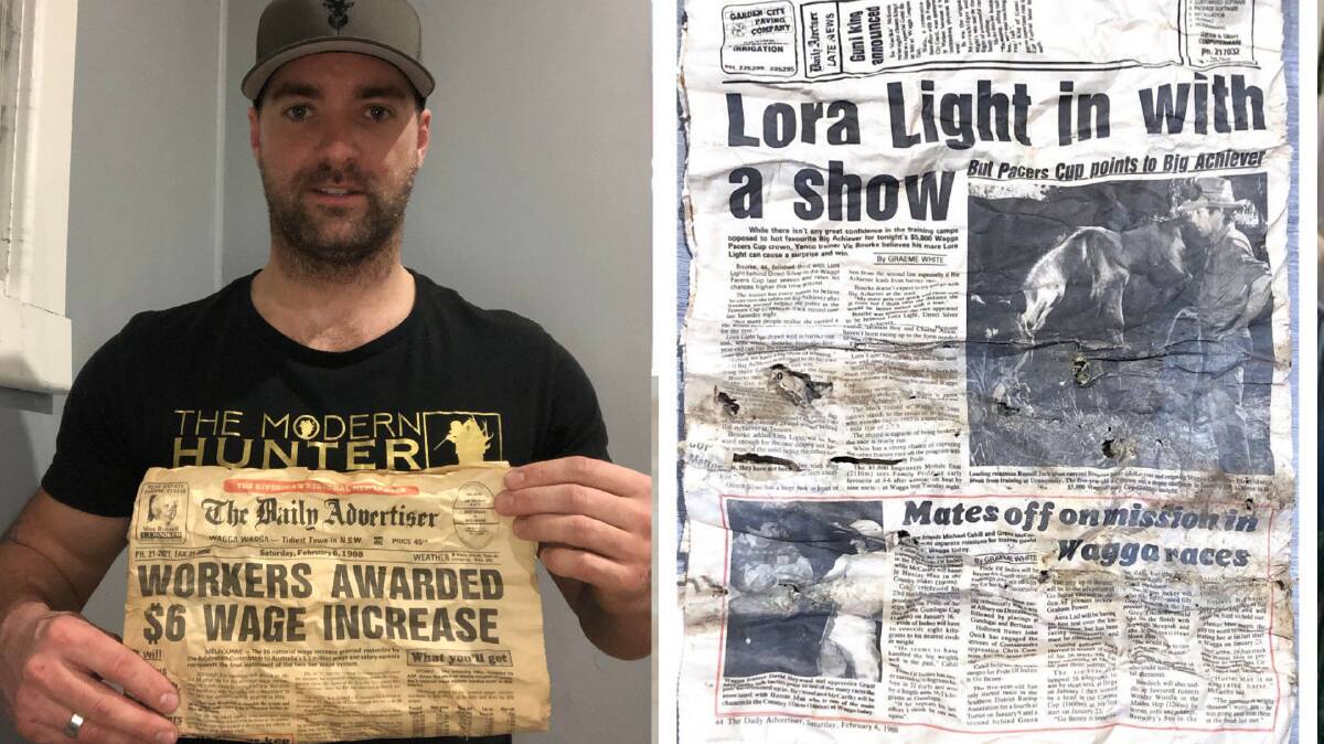 DISCOVERY: Wagga resident Josh Howell with some of the pages from The Daily Advertiser February 6 1988 edition that he found in his wall.