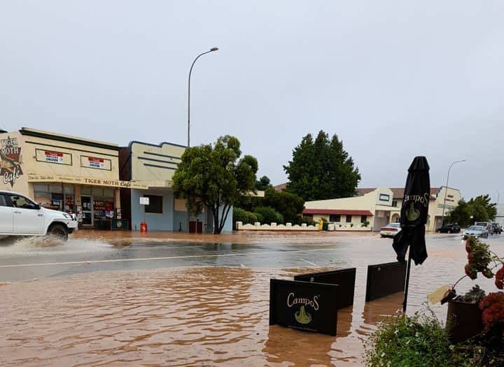 Water pools outside Temora businesses along Hoskins Street during flooding in March. The council area now has access to a federal and NSW joint disaster recovery program.