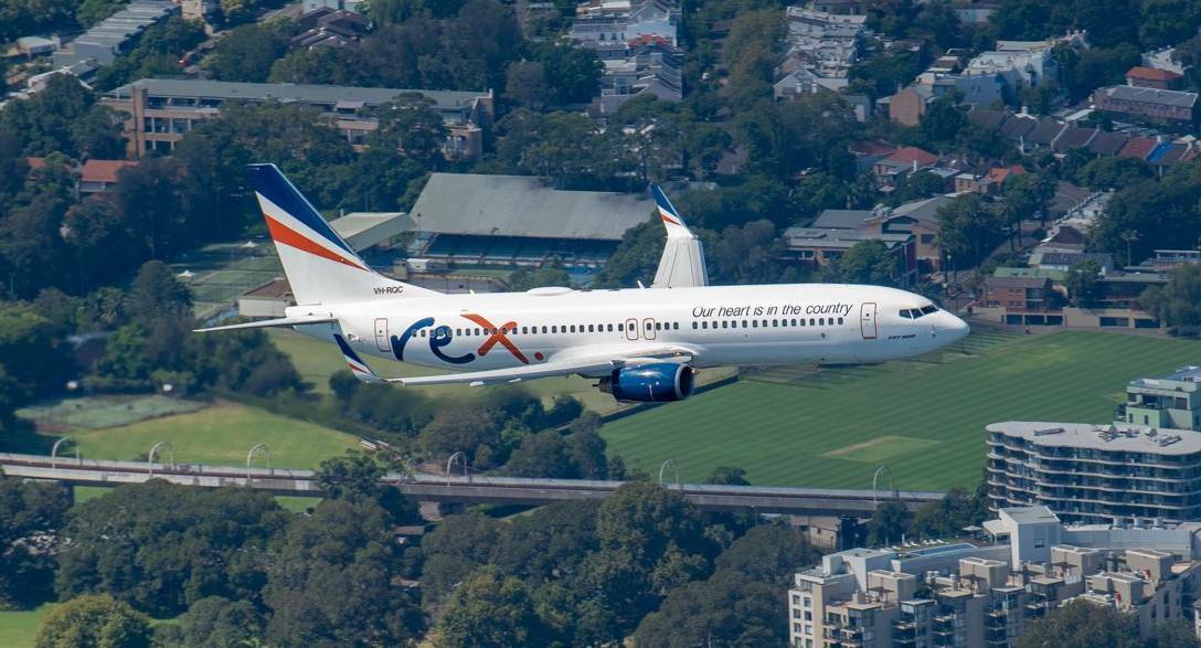 One of Regional Express's Boeing 737 aircraft in flight over Sydney. Picture: Regional Express/twitter.