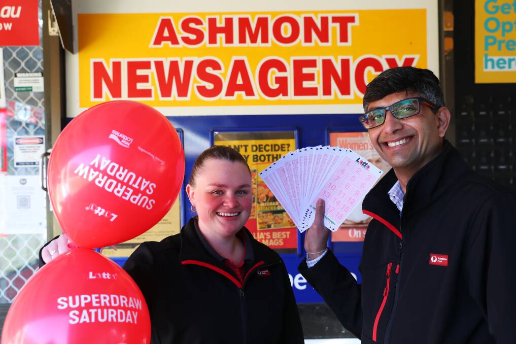 LUCKY: Emily Mack and Himanshu Rawal outside Ashmont Newsagency, which sold a $2 million ticket to a Wagga man in Saturday's Lotto draw. Picture: Emma Hillier
