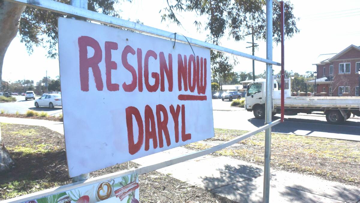 A sign near the corner of Tarcutta and Morgan streets urges Wagga MP Daryl Maguire to resign over revelations at an anti-corruption hearing. Picture: Rex Martinich