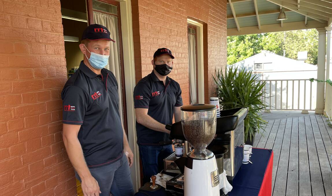 BARISTAS: PBCC Rapid Relief Team members Allan Doven and Trevor Holt provide coffee for homeless people at St Vincent's Christmas breakfast.
