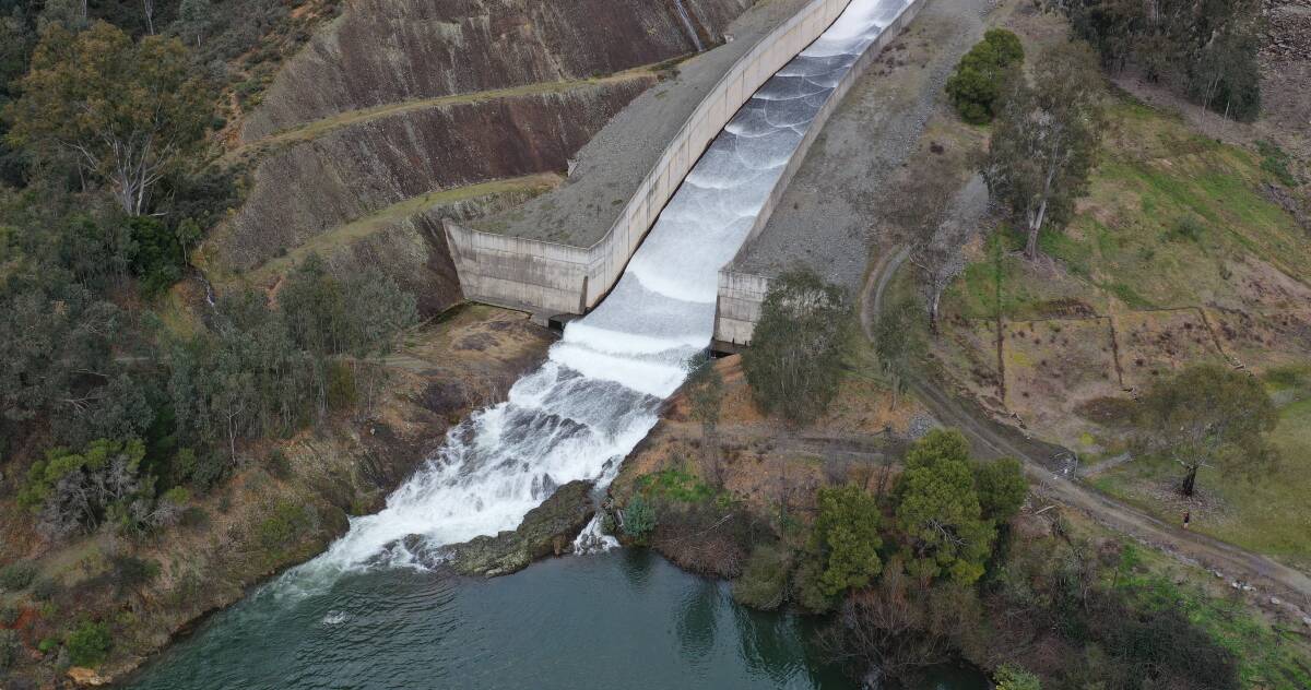 Water overflows over the Blowering dam spillway on Thursday. Picture: Rhys Creed