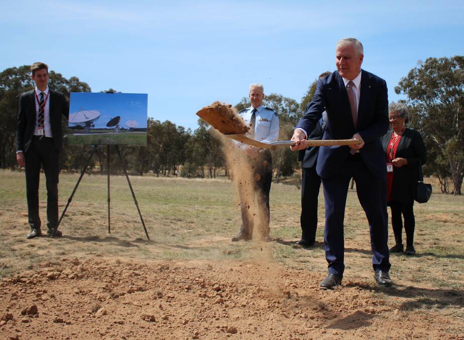 Deputy Prime Minister Michael McCormack turns the first sod at the Kapooka Blamey Barracks for the Ground Station East satellite project in October 2018.