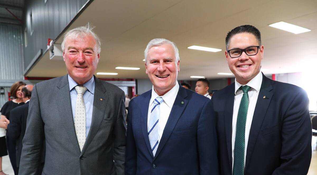 Regional Express deputy chairman John Sharp (left), Riverina MP and federal Transport Minister Michael McCormack and Nationals NSW MLC Wes Fang at the airline's pilot graduation ceremony at its Wagga training centre last year.