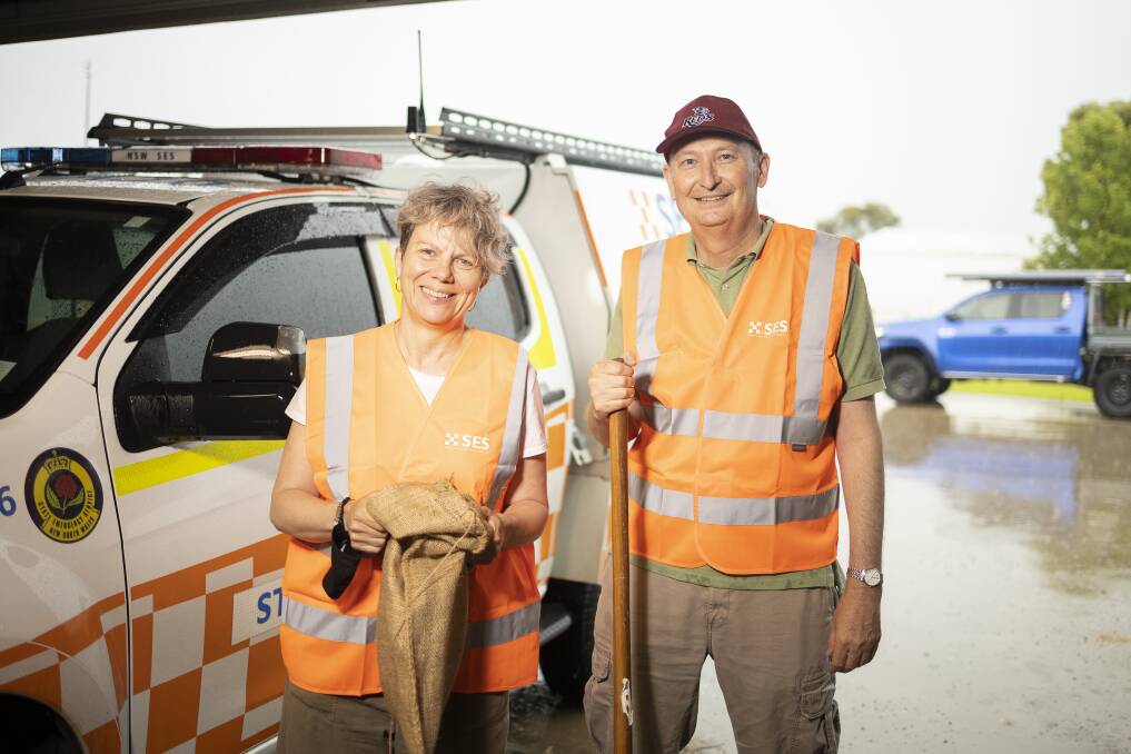 HELPING HAND: Helen and Stewart Hobbs came down to help the SES fill sandbags at its Ashmont headquarters on Friday afternoon. Picture: Ash Smith.