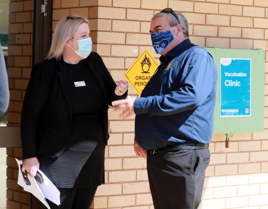 MLHD COVID-19 Coordinator Emma Field and Riverina Murray Regional Alliance chairman John Fernando at the Wagga Base Hospital vaccination clinic. Picture: Les Smith.