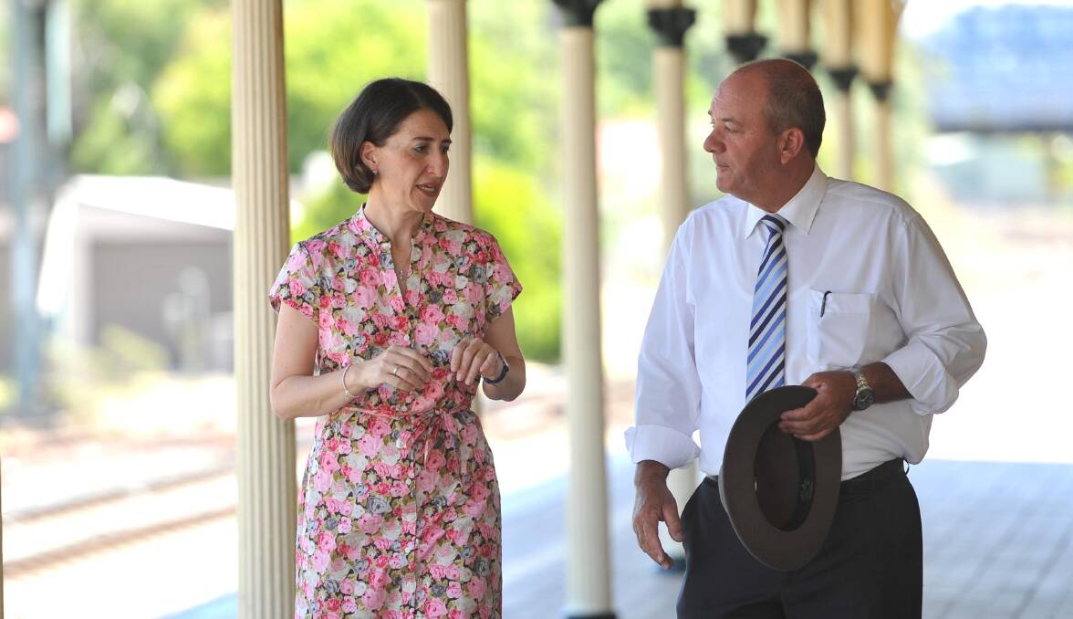 SCRUTINY: Then NSW Transport Minister Gladys Berejiklian and then Wagga MP Daryl Maguire in 2015. ICAC has heard their relationship was disclosed to a staff member in 2018.