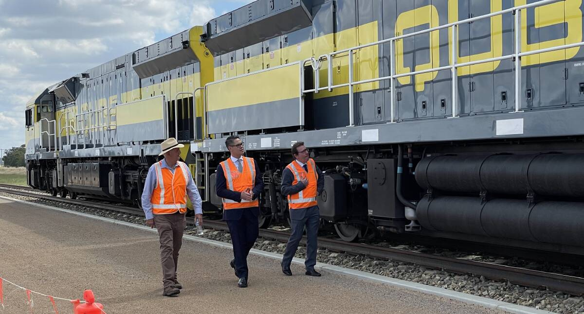 Then Wagga mayor Greg Conkey, Wagga-based Nationals MLC Wes Fang and independent Wagga MP Joe McGirr in December inspect a locomotive on the Riverina Intermodal Freight Hub's new siding. The major project has been cited as reason to have the Inland Rail freight upgrade pass through Wagga. Picture: Rex Martinich