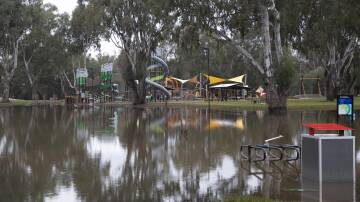 The new Riverside playground at Wagga Beach reemerges from flood waters on Saturday morning after the Murrumbidgee River level fell over the past few days. Picture: Madeline Begley