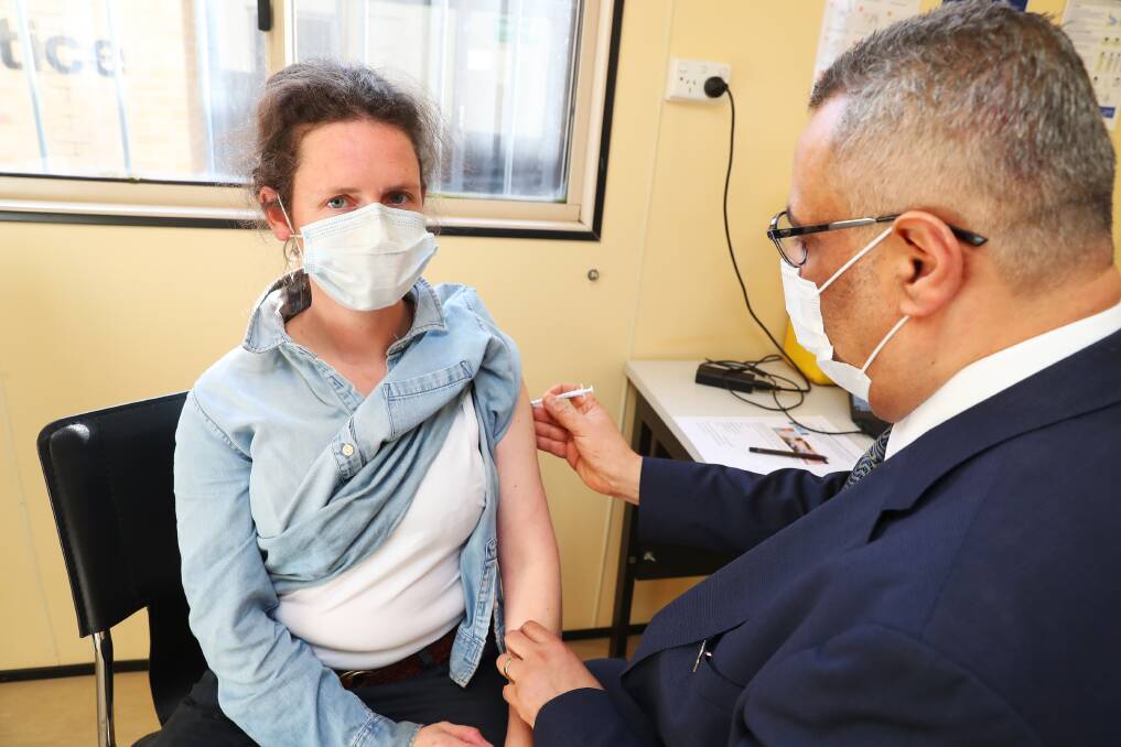 DOSE: Glenrock Country Practice director Dr Ayman Shenouda administers Pfizer vaccine to Mangoplah's Kate Smith at the federal vaccine hub. Picture: Emma Hillier.