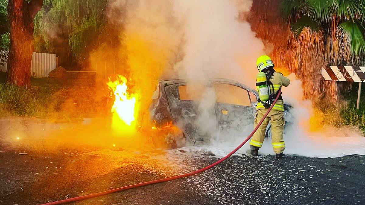 Firefighters extinguish a car fire in Ashmont last year. Wagga's council area has seen a fall in the number of motor vehicle thefts, many of which end up with the vehicle being torched. Picture: Fire and Rescue NSW Turvey Park