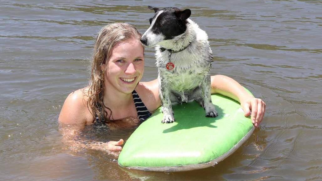 SURF'S UP: Pip Lloyd from Wagga with seven-year-old 'Whippy' beat the heat at Wagga Beach as the mercury hit 40 degrees in December.