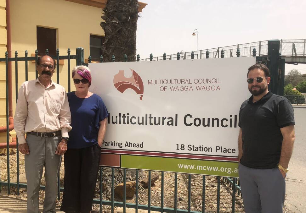 POLICY: Multicultural Council of Wagga chief executive Belinda Crain (centre) with Iraqi Yazidi refugees Khedder Sharkan and Shab Mahmood.