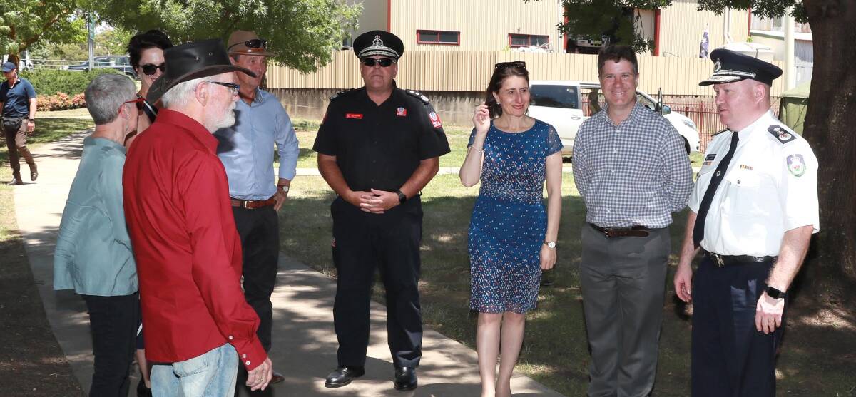 INQUIRY: NSW Premier Gladys Berejiklian (third from right) and Rural Fire Service Commissioner Shane Fitzsimmons (right) visit Tumbarumba earlier this month. The premier on Thursday announced a bushfire inquiry.