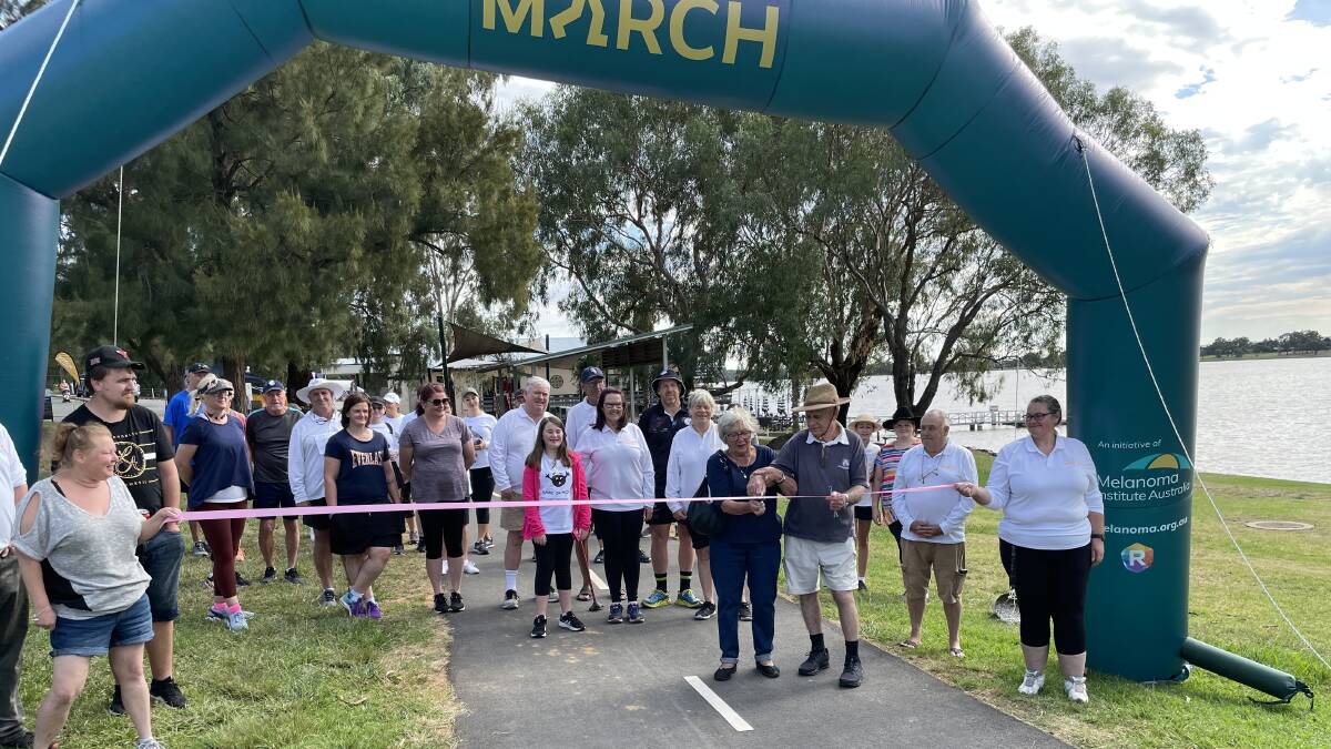 START: The ribbon is cut for Wagga's Melanoma March on Sunday, allowing about 60 participants to complete their lap of Lake Albert for skin cancer research and prevention. Picture: Rex Martinich