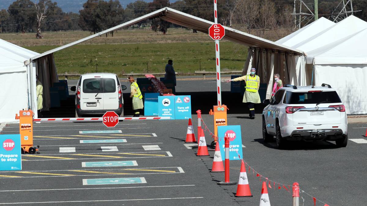 Vehicles enter the Murrumbidgee Local Health District's new drive-through COVID-19 testing set at Wagga's Equex Centre on its first day of operation. Picture: Les Smith