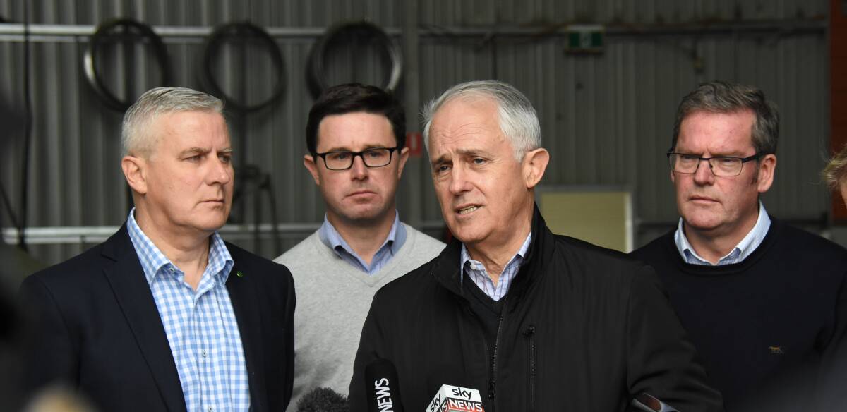 Riverina MP Michael McCormack, Agriculture Minister David Littleproud, and PM Malcolm Turnbull and John McVeigh at HE Silos in Forbes on Sunday. Photo: Forbes Advocate/Renee Powell