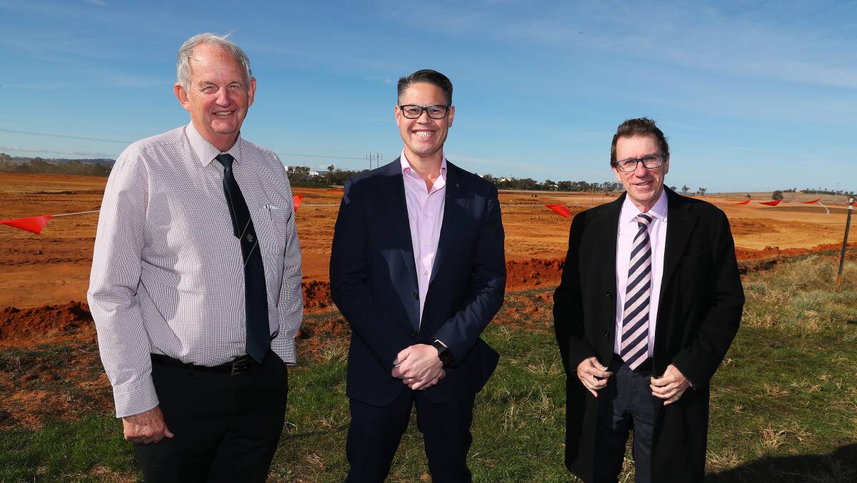 Wagga mayor Greg Conkey, Nationals MLC Wes Fang and Wagga MP Joe McGirr at the Riverina Intermodal Freight and Logistics Hub constructions site at Bomen in May. The project will be aided by the single biggest sending item in the NSW budget for 2021-22.