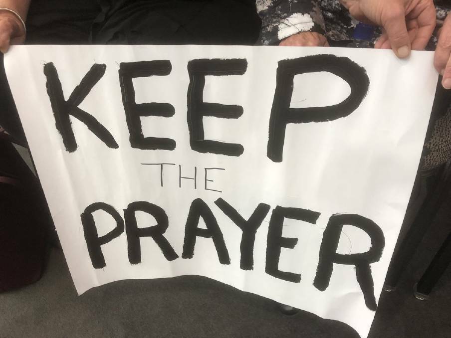 Protesters urge Wagga City Council to retain prayers as part of council meeting procedure. 