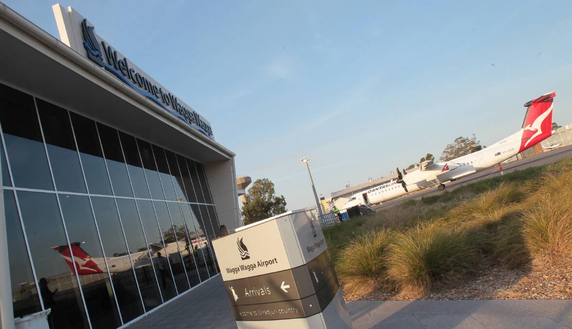 A QantasLink plane at Wagga airport. Wagga remains in competition with regional cities across Australia for the airline's new pilot training centre.