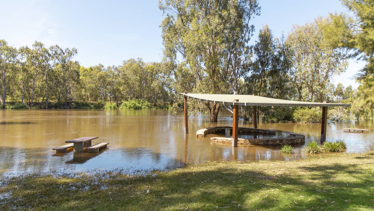 RECEDING: The Murrumbidgee River level remained around the barbecue shelter at Wagga beach on Monday afternoon. Picture: Ash Smith