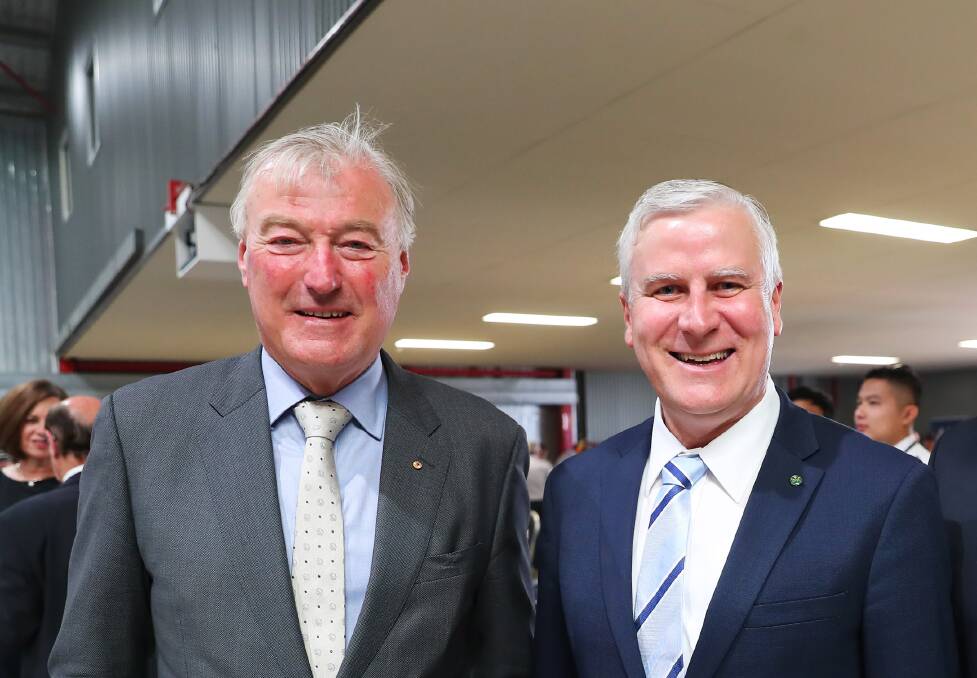 Regional Express deputy chairman John Sharp, then Transport Minister and Deputy PM Michael McCormack, at the airline's pilot graduation ceremony in Wagga in 2019. Mr Sharp is now in line to receive up to $1.9 million shares as an executive bonus less than a year after Mr McCormack oversaw $62 million in taxpayer aid for the airline.