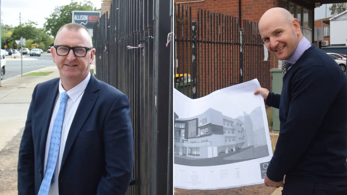 International Hotel majority owner Basil Berrigan (left) and minority owner and former manager Joel Berrigan (right) with his plans for a new hotel.