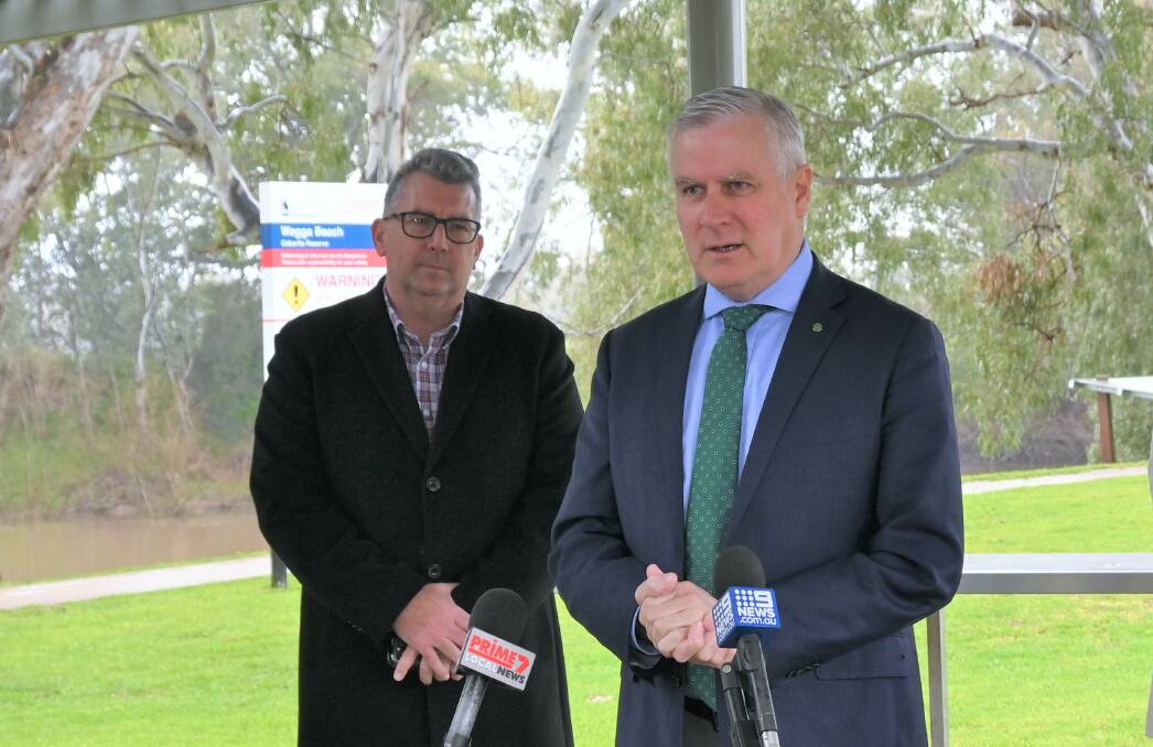 Riverina MP Michael McCormack at Wagga Beach last week with Resources Minister Keith Pitt. Mr McCormack said the Riverina would benefit from people in capital cities seeking new job opportunities during the pandemic. Picture: Kenji Sato. 