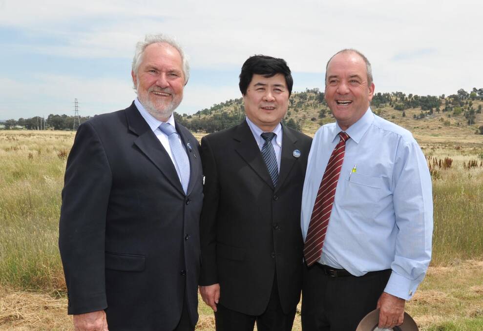 LAND: Wuai Group's Zhaoxiang Jin at the Trade Centre's proposed Copland Street site with then-Wagga MP Daryl Maguire and then-Wagga mayor Rod Kendall in 2013. Wagga council has now moved to sell the land.