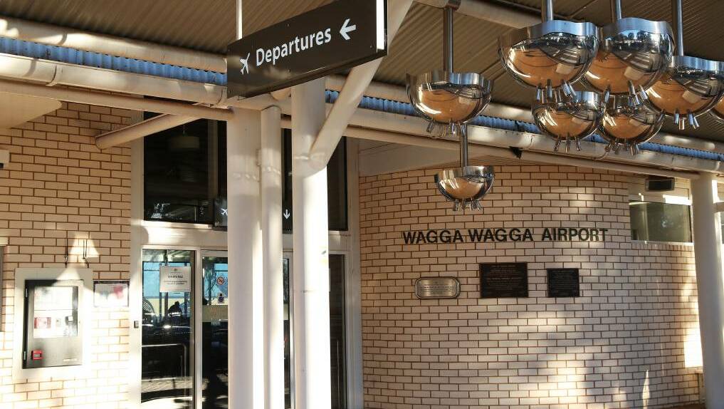 A woman from Coffs Harbour sued Wagga council after being injured by an automatic door at the city's airport.
