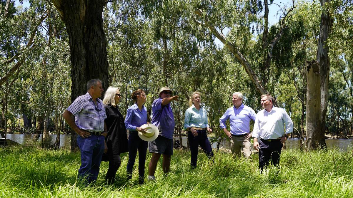 Forbes councillors Chris Roylance and Phyllis Miller, NSW NSW Minister for Emergency Services and Resilience Steph Cooke, Bedgerabong property owner Scott Darcy, Senator Bridget McKenzie, Riverina MP Michael McCormack and NSW Agriculture Minister Dugald Saunders on flood-affected land outside Forbes. Picture: Contributed