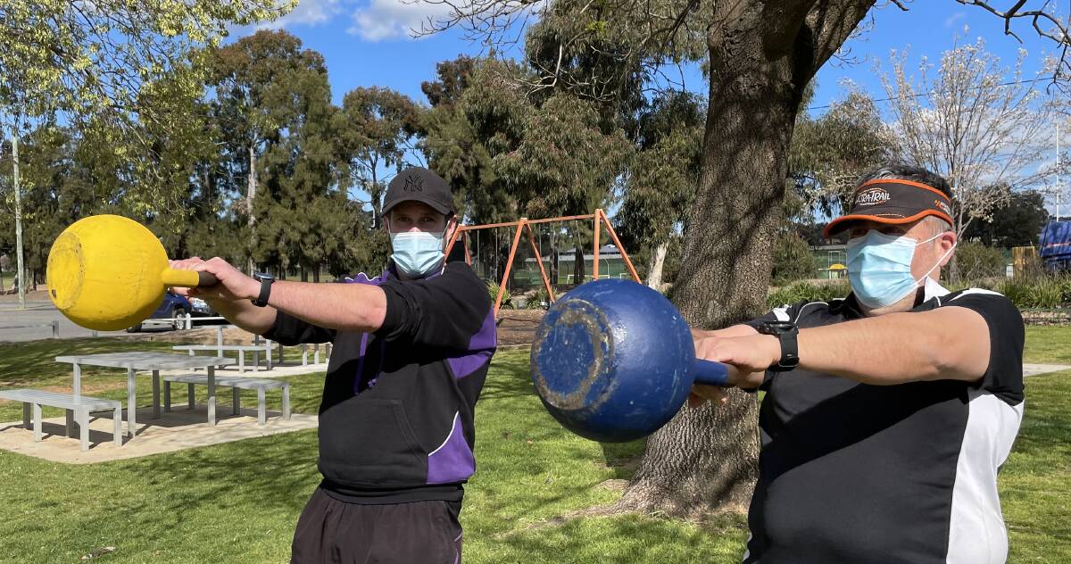 In Motion Fitness director Mick Wainwright with personal training client Alex Aldana in Jubilee Park on Thursday. Picture: Rex Martinich