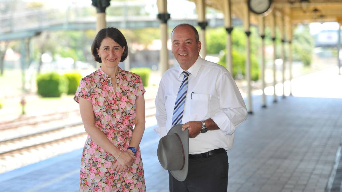 INVESTIGATION: Then NSW transport minister Gladys Berejiklian and then Wagga MP Daryl Maguire at Wagga Railway Station in 2015. Picture: Les Smith