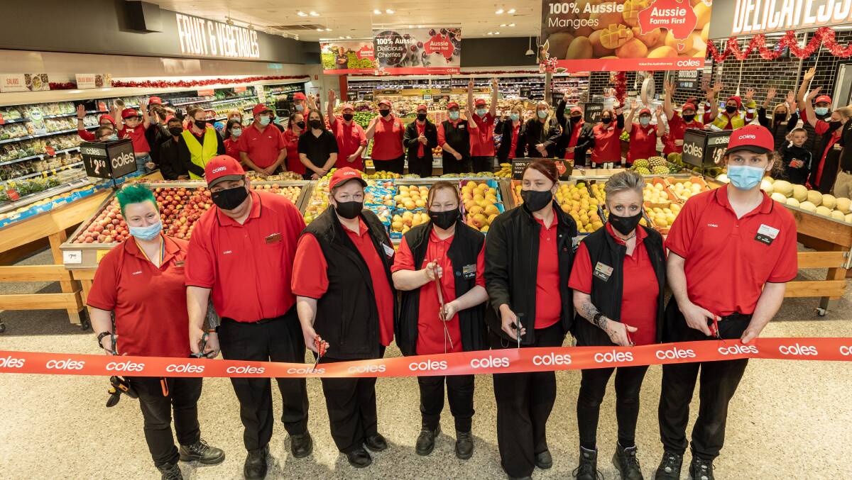 Wagga Sturt Mall Coles supermarket staff celebrate the opening of their revamped store on Wednesday morning. Picture: contributed.