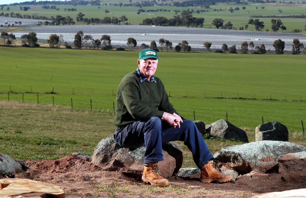 WARNING: Eunony Valley crop farmer John Gray on his property with the Bomen Solar Farm in the background. Mr Gray is urging the NSW government to take care with new zones for renewable energy projects. Picture: Les Smith 