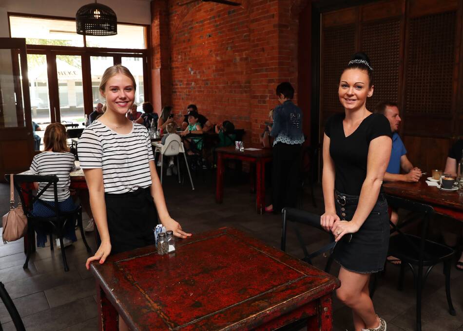 Uneke Lounge staff Abby Gestier and Jeni Cook have adapted to the new one person per four square metres rule implemented by the federal government due to coronavirus. Picture: Emma Hillier
