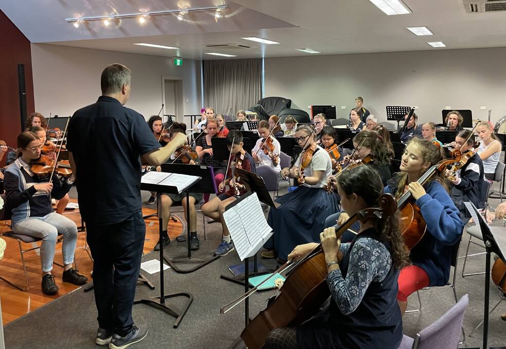 IN TUNE: Conductor Brett Thompson leads the Riverina Youth Orchestra during a rehearsal on Wednesday for the 'Symphonic Sounds' concert. Picture: Rex Martinich